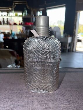 Vintage collectible glass flask with metal top